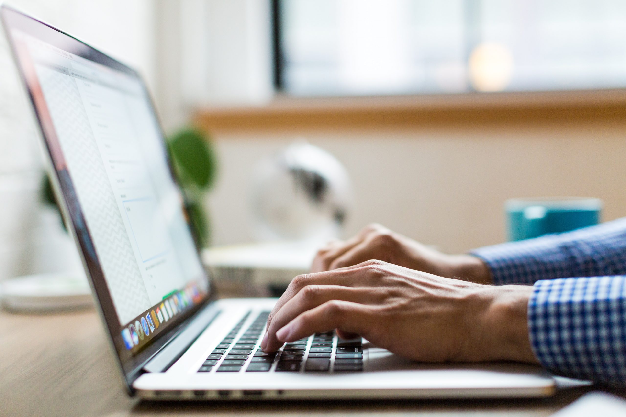 Person working at a laptop on a business internet connection